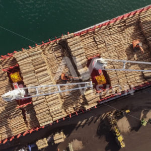 Log ship loading at Northport, Marsden Point - Aerial Vision Stock Imagery